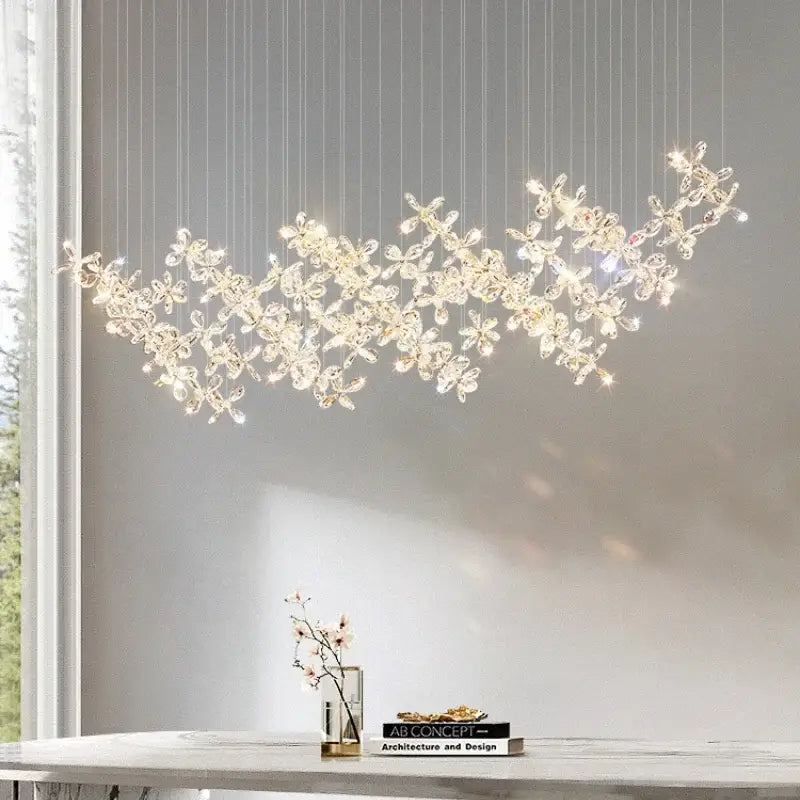 A delicate modern decorbites crystal led chandelier with a flowing branch design and warm glowing lights for dining room