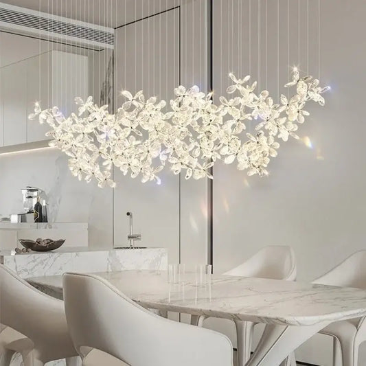 A modern decorbites crystal led chandelier with delicate floral design hangs from ceiling for dining room decor