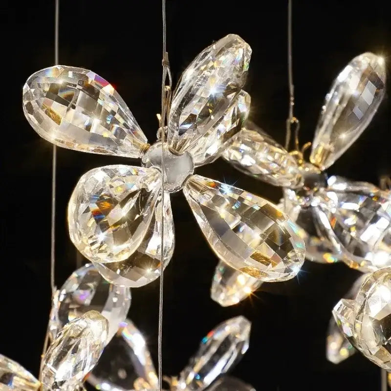 A modern floral decorbites crystal led chandelier with clear faceted glass petals for dining room lighting