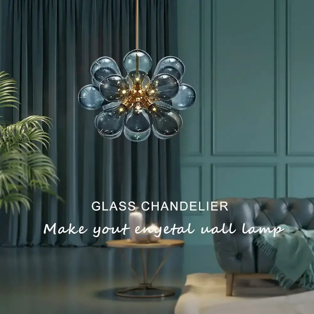 Modern floral teal glass ball pendant light with gold-toned center and translucent blue-gray decorbites glass ball bulbs