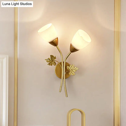 DecorBites™ DecorBites™ Modern Floral Wall Lamp: Milk Glass 2-Bulb Sconce Light in Black/Gold with Metal Leaf Accent