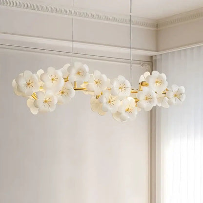 Modern floral white and gold pendant light with delicate flowers and metal finish for practical illumination in kitchens
