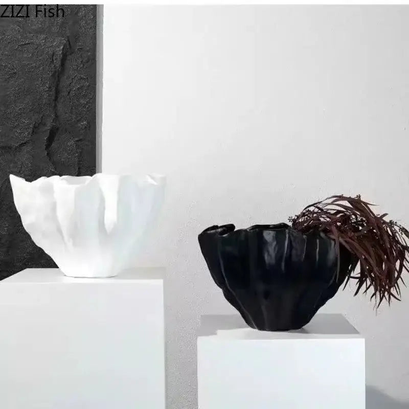Modern fluted black resin bud vase with glossy petal-like ridges and dark brown dried foliage for bedroom decorbites black resin decor