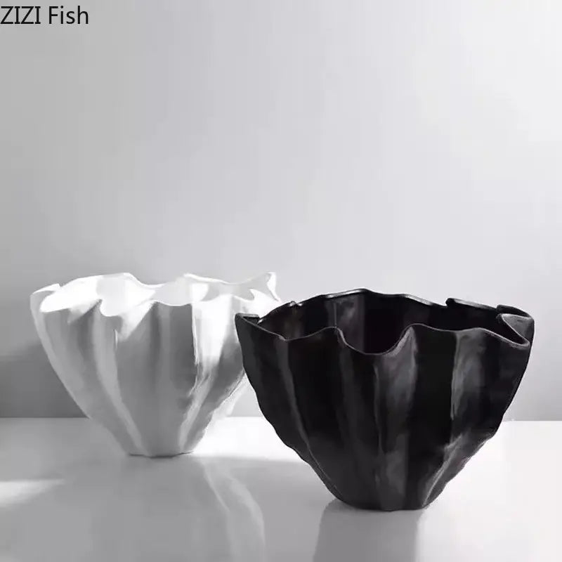 Black resin bud vase with a modern fluted ruffled rim and glossy finish for bedroom decor by decorbites black resin