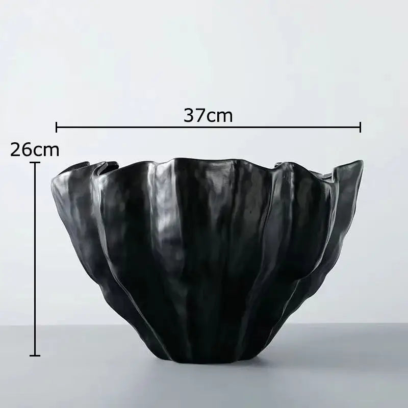 Modern fluted black resin bud vase with glossy finish and ruffled edges for decorbites black resin floral decor