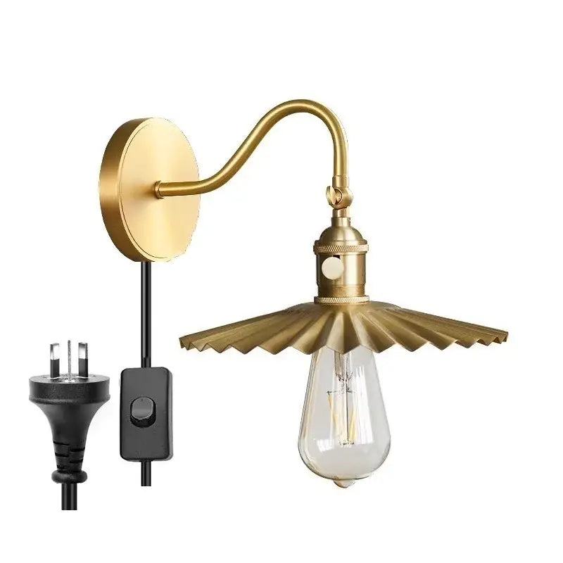 Brass-finished modern fluted wall sconce with scalloped shade and exposed Edison bulb decorbites adjustable copper wall light