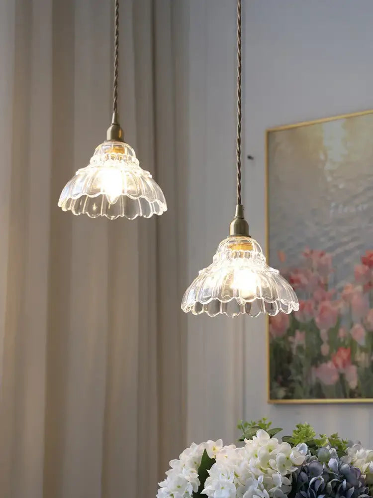 Two clear glass pendant lights with fluted petal edges and brass glass pendant fixtures for modern dining room decorbites brass glass