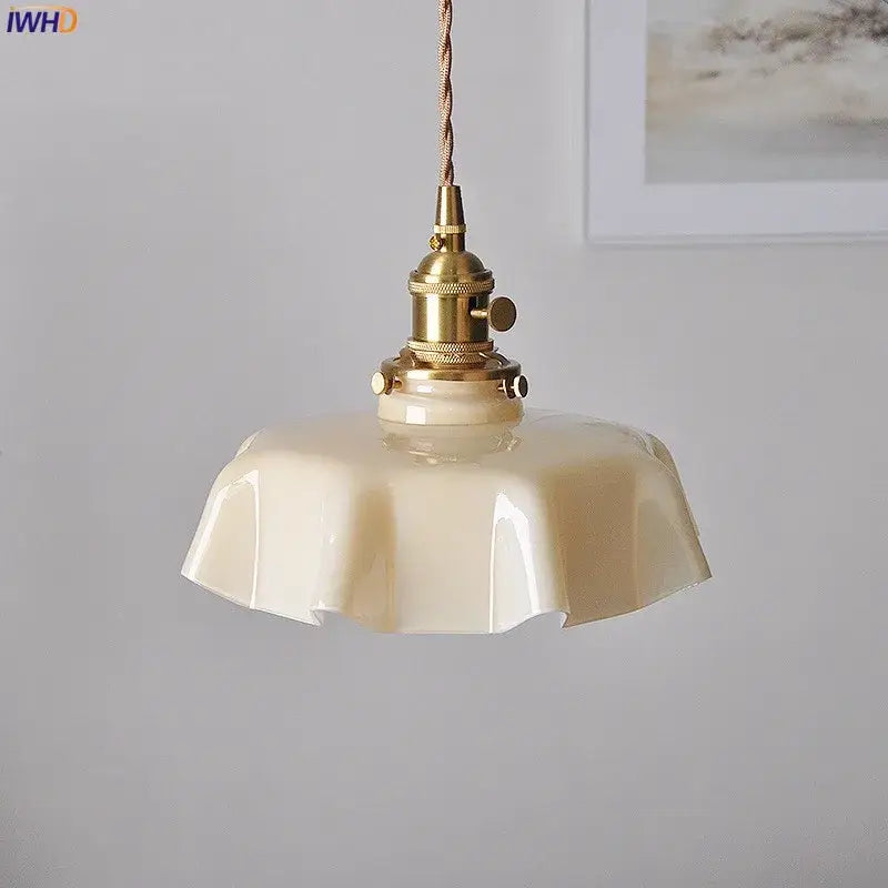 Modern fluted cream glass pendant light with brass fixture and twisted cord for dining room pendant lights