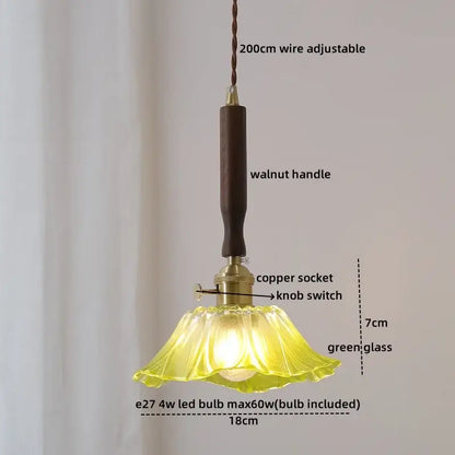 A delicate green glass pendant light with a fluted design and dark walnut handle in decorbites led walnut copper style
