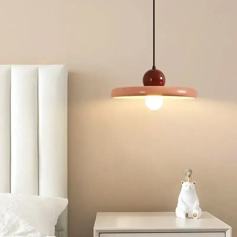 Modern french cream metal pendant light with glossy red spherical top and wide peach ceramic shade for dining room
