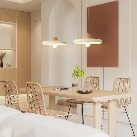 Modern french cream metal pendant light with matte white shades and wooden accents for dining room use