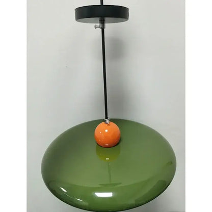 Modern french cream metal pendant light with olive green ceramic glossy finish and orange spherical accent for dining room