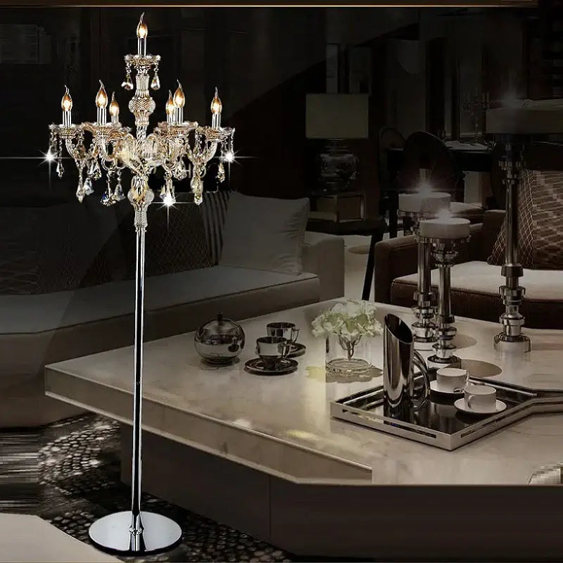 Elegant crystal floor lamp with lit candle bulbs and teardrop crystals on chrome stand for modern living room decorbites crystal floor