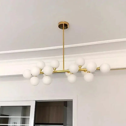 Gold-toned modern frosted glass ball led chandelier with multiple globe bulbs in a branching design for dining room decorbites glass ball