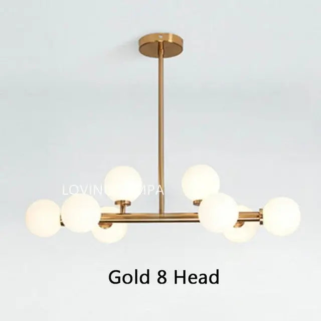 Modern frosted glass ball LED chandelier with gold-toned metal and eight globe lights for dining room decorbites glass ball