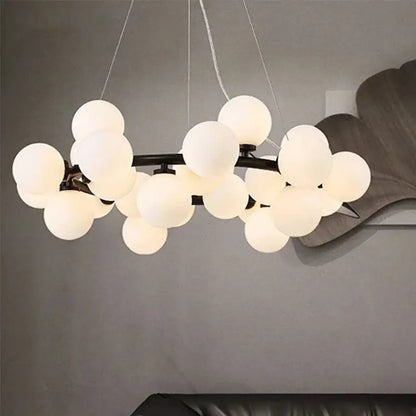 Modern frosted glass ball led chandelier with multiple white spherical glass globes on dark metal frame for dining room decorbites glass ball
