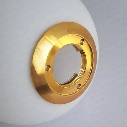 Modern frosted glass ball pendant light with gold ring features a gold metallic faucet escutcheon with three screws