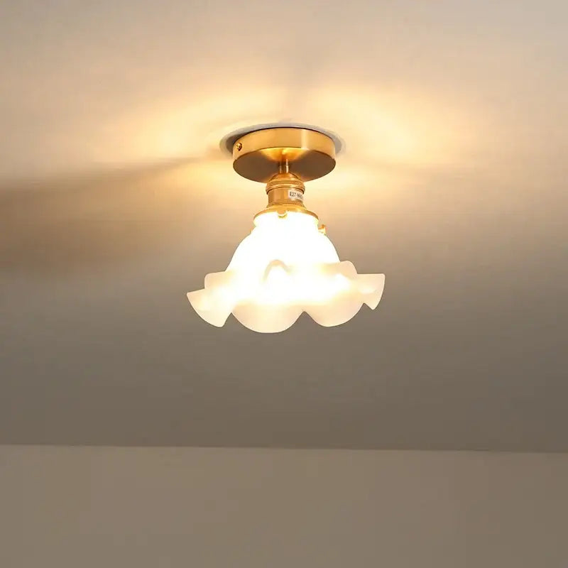 Modern gold-finished ceiling light with frosted glass led ceiling shade shaped like an open flower for corridor use