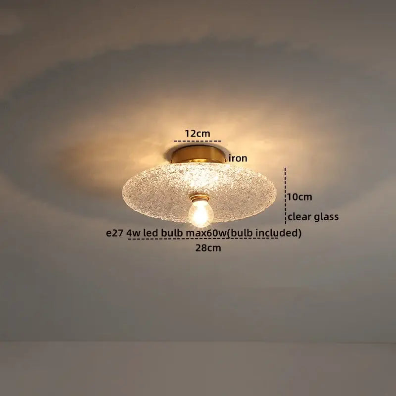 Modern frosted glass led ceiling light with a round clear glass led ceiling and brass iron base featuring exposed bulb