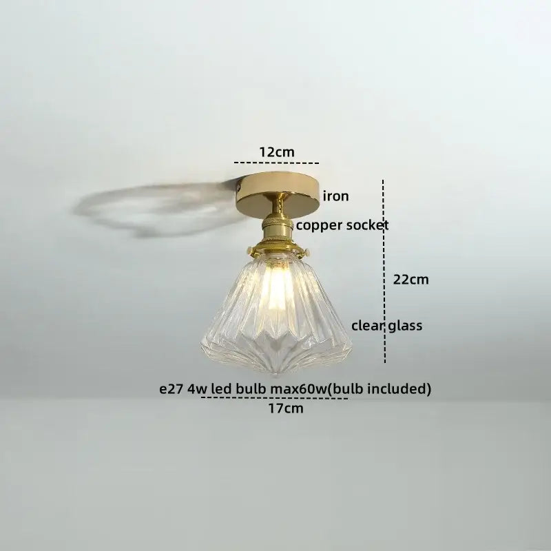 A vintage-style ceiling light with brass copper socket iron base and faceted glass shade for modern glass led ceiling use