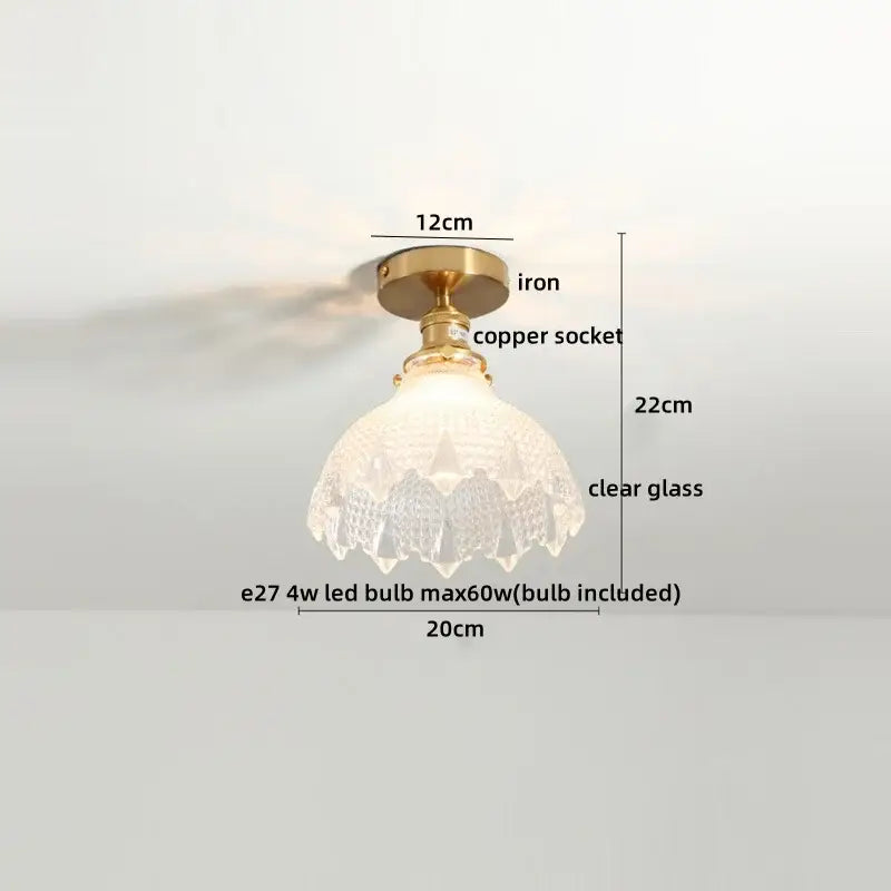 A vintage-style ceiling light with brass iron base copper socket and intricate clear glass shade for glass led ceiling use