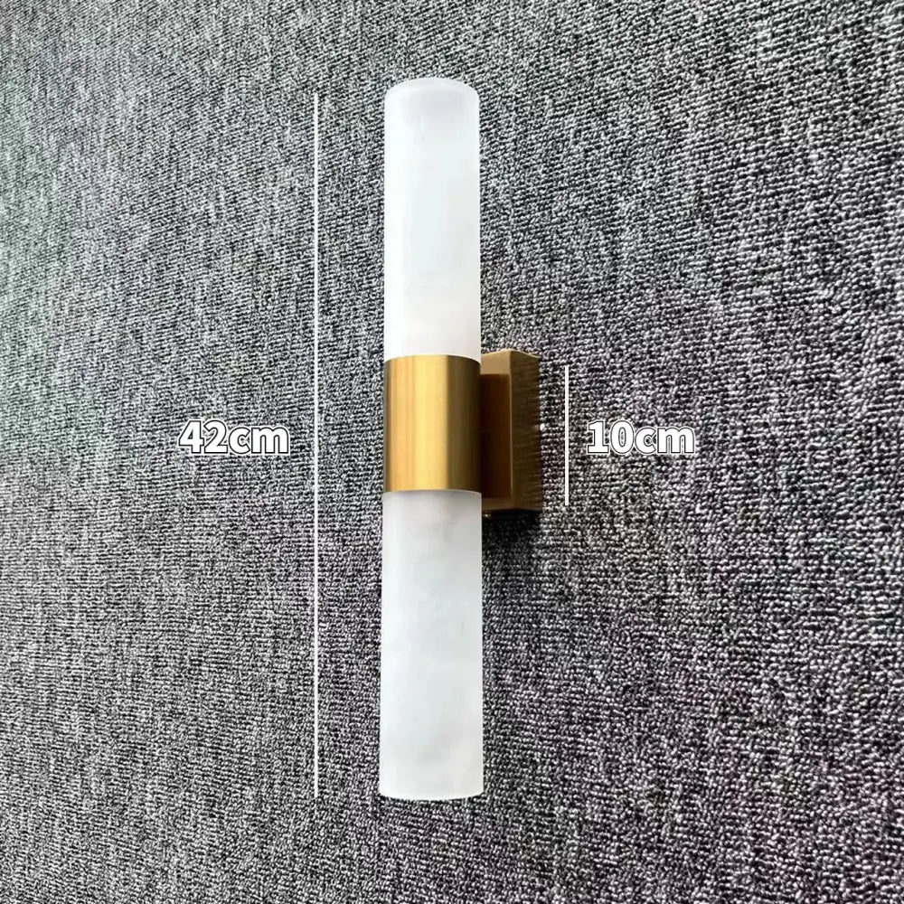 Modern led wall lamp featuring frosted glass shades with a brushed brass accent band for bedroom use