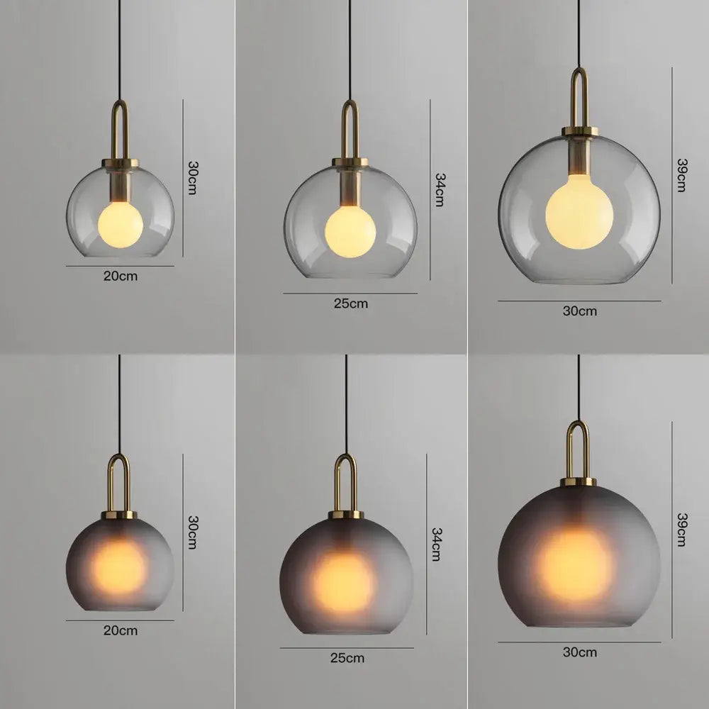 Modern frosted gray glass ball pendant light with brass fixtures and exposed bulb ideal for dining room decorbites glass ball pendant