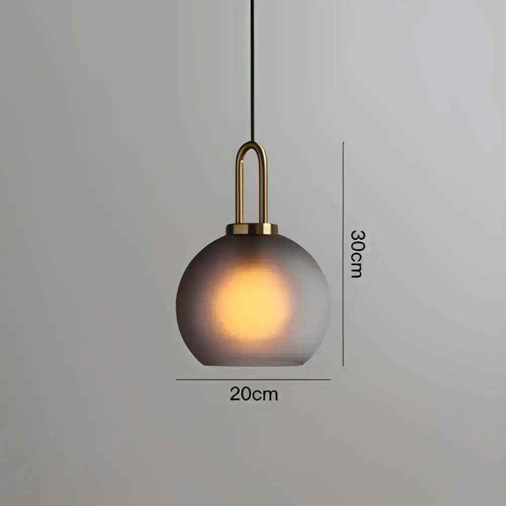 A modern frosted gray glass ball pendant light with brass hardware for dining room decorbites glass ball pendant