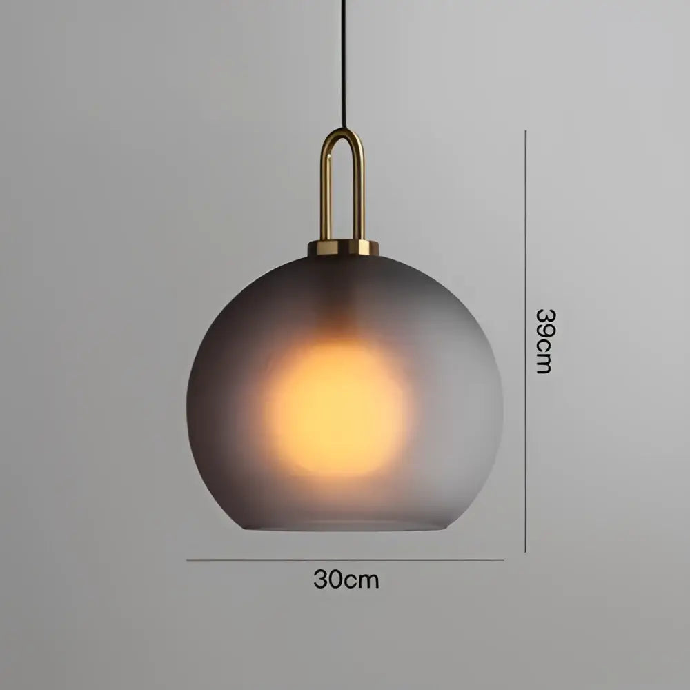 Modern frosted gray glass ball pendant light with brass hardware ideal for dining room decorbites glass ball pendant