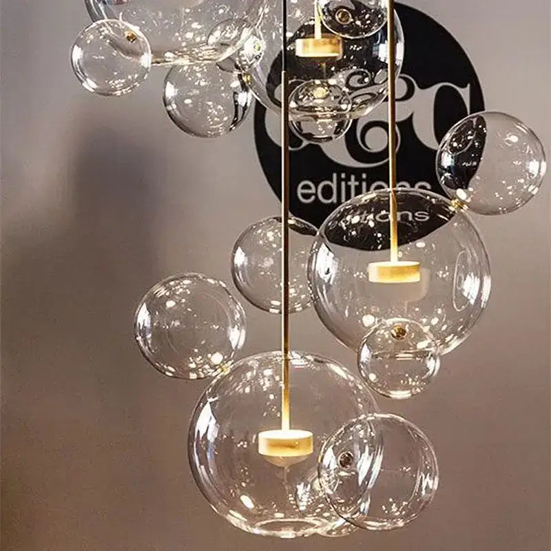 Modern frosted white bubble ball pendant light with clear glass bubble and gold-toned decorbites bubble ball accents for kitchen island