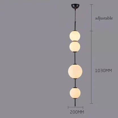 Black metal pendant lamp with four frosted white glass balls ideal for modern dining room lighting