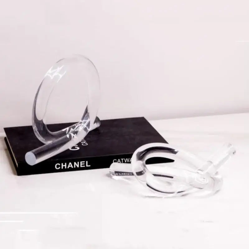 Clear acrylic geometric rope knot sculpture with interlocking circular forms for modern home decor living room display