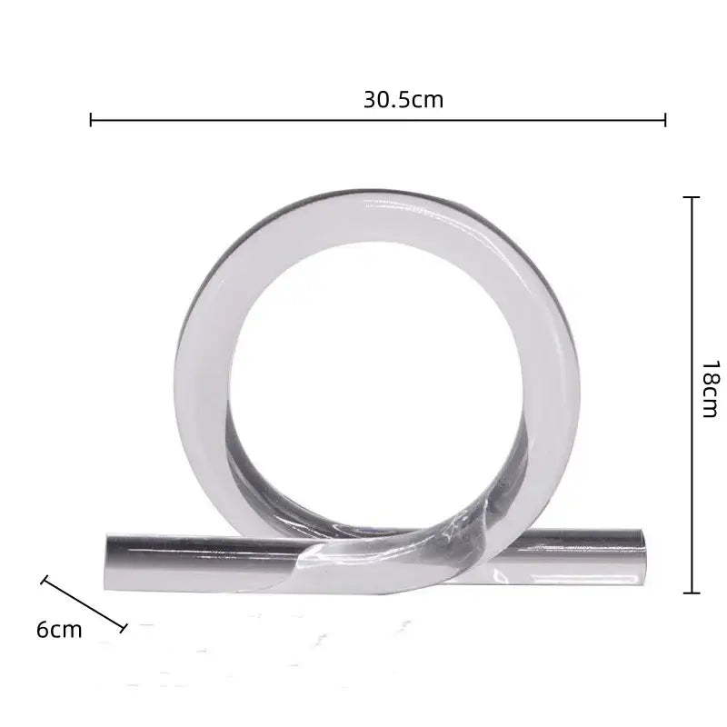 A sleek minimalist metallic ring with polished chrome finish and twisted design for modern geometric acrylic rope knot decor