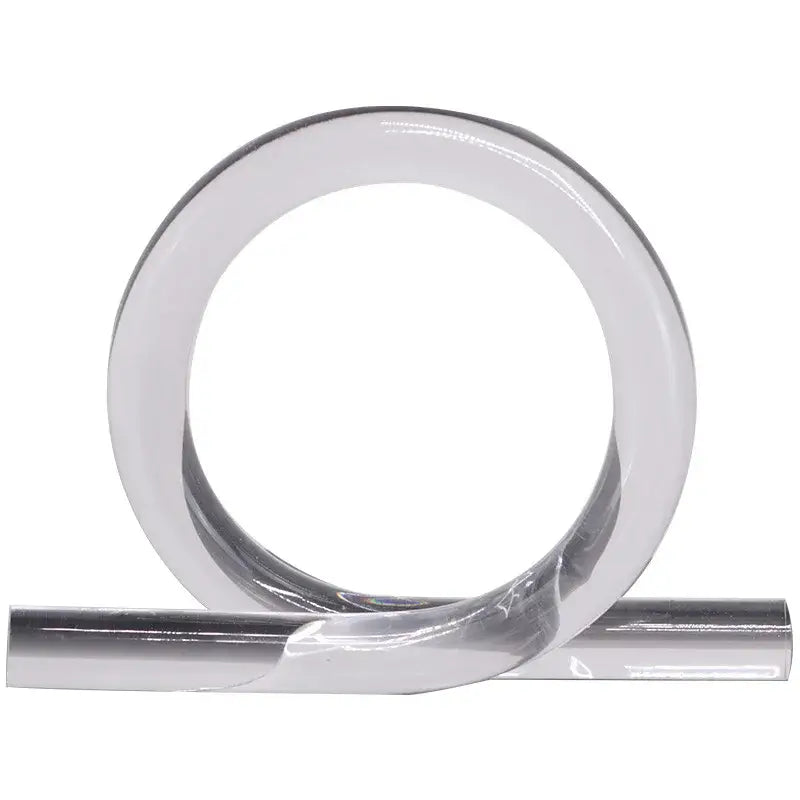 A sleek transparent adhesive tape roll with metallic silver backing ideal for modern geometric acrylic rope home decor