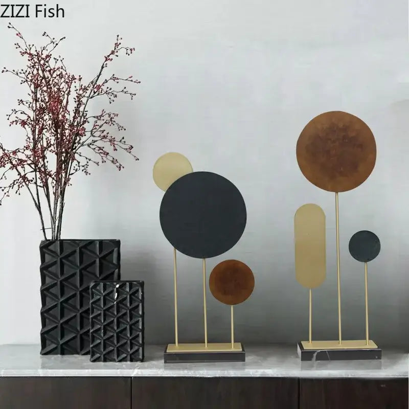 Modern geometric alloy marble base statue with circular metal discs in matte black bronze and gold for home decor by decorbites