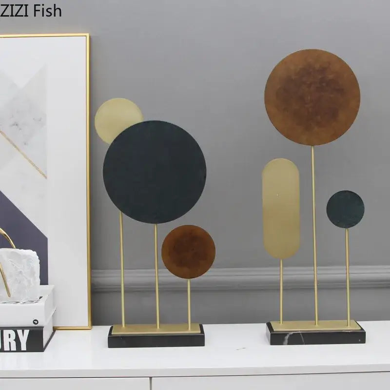 Modern geometric alloy marble base statue in matte black gold and bronze tones for home decor by decorbites