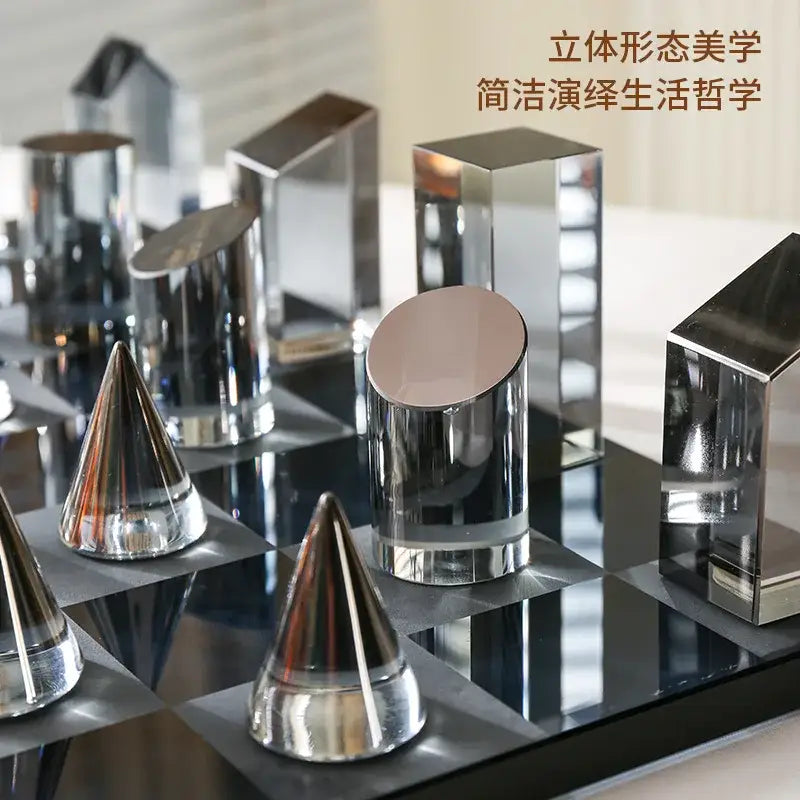 Modern geometric amber and silver chrome-finished chess set on a reflective black and white board for home decor