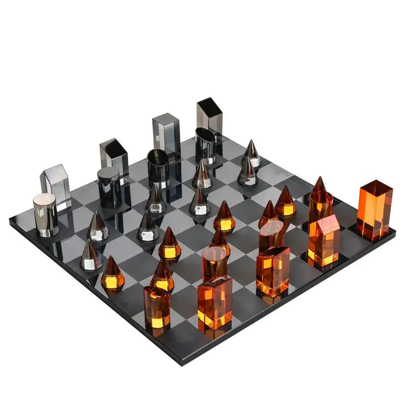 Modern geometric amber and silver chess set with translucent pieces on a glossy board for stylish home decor