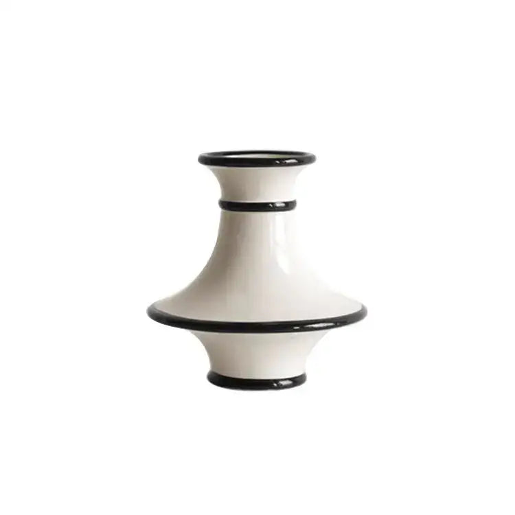 A sleek white ceramic vase with geometric black bold accent rings and white stripes ideal for decorbites geometric black decor