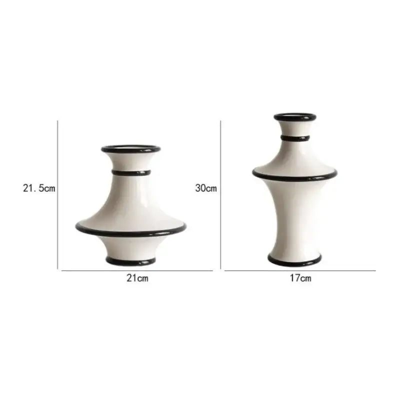 Two minimalist ceramic vases with geometric black and white stripes decorbites geometric black living room decor