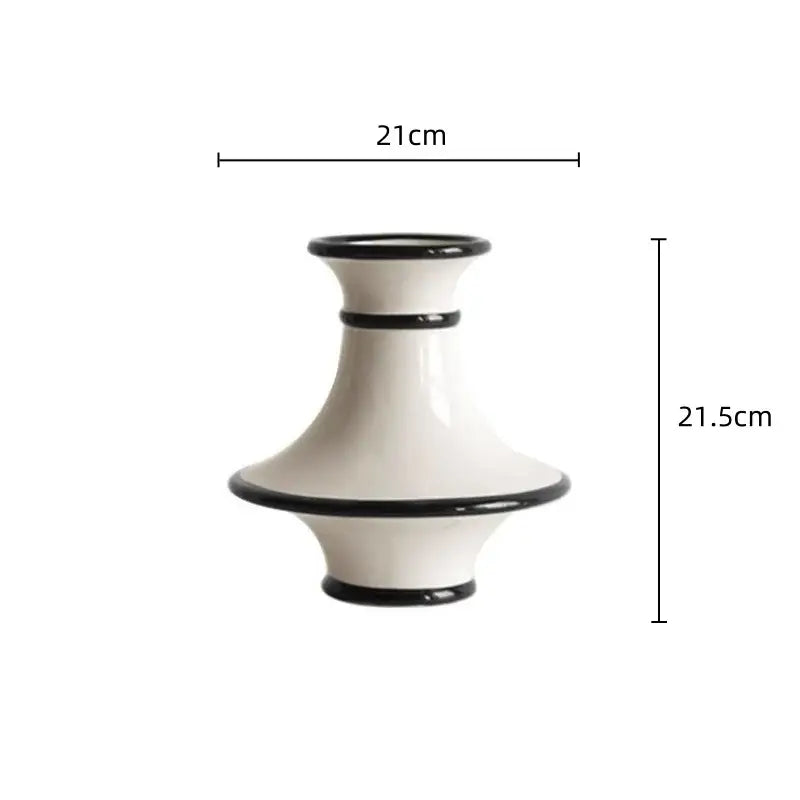 A sleek white ceramic vase with geometric black accent rings and white stripes for modern decorbites geometric black decor