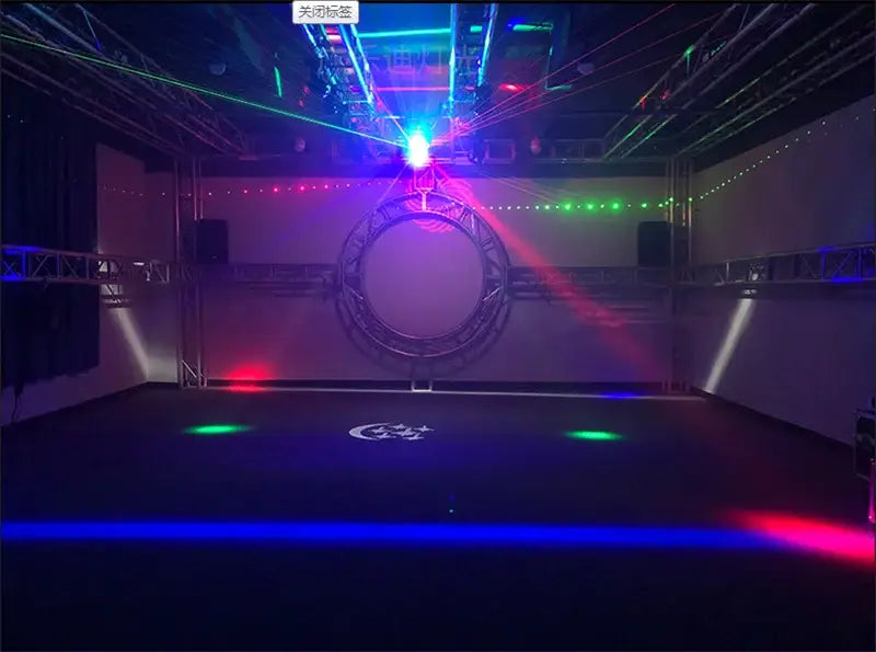 Modern geometric black metal light bar strobe with red and green laser beams on circular stage frame in indoor venue