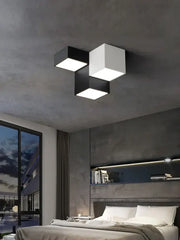 Modern geometric black and white cube bedroom ceiling lamp with three minimalist cube panels in staggered design