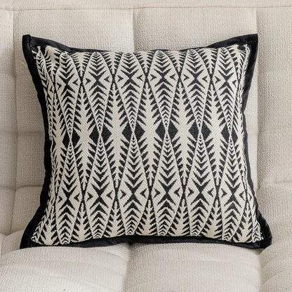 Modern geometric black and cream embroidered pillow cover with velvet trim for living room decor