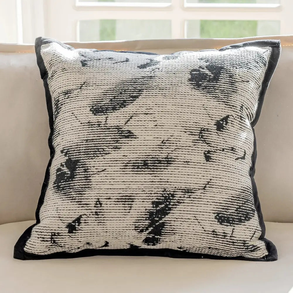 Modern geometric black and cream embroidered pillow cover with woven abstract pattern for living room decor