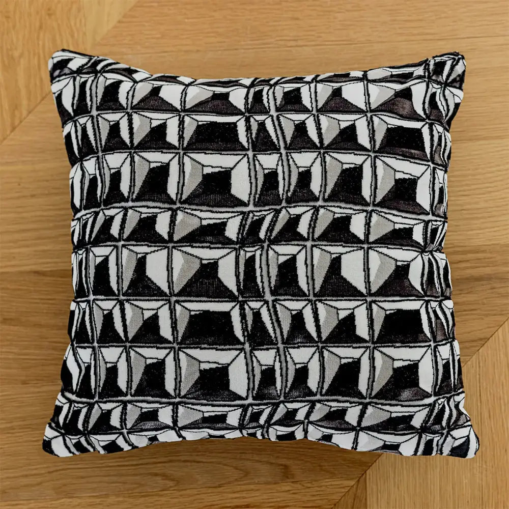 Modern geometric black and white embroidered pillow cover with textured woven fabric for living room decor