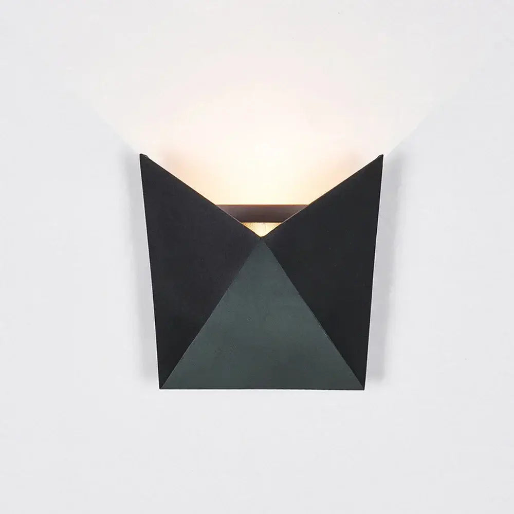 Modern geometric black led wall light with angular triangular facets and warm light for living room decorbites led wall
