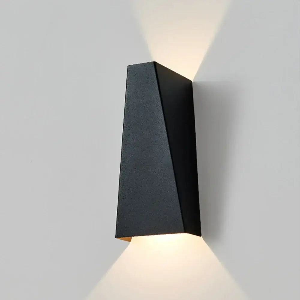 Modern geometric black matte led wall sconce with angular design casting warm light for living room decorbites led wall light