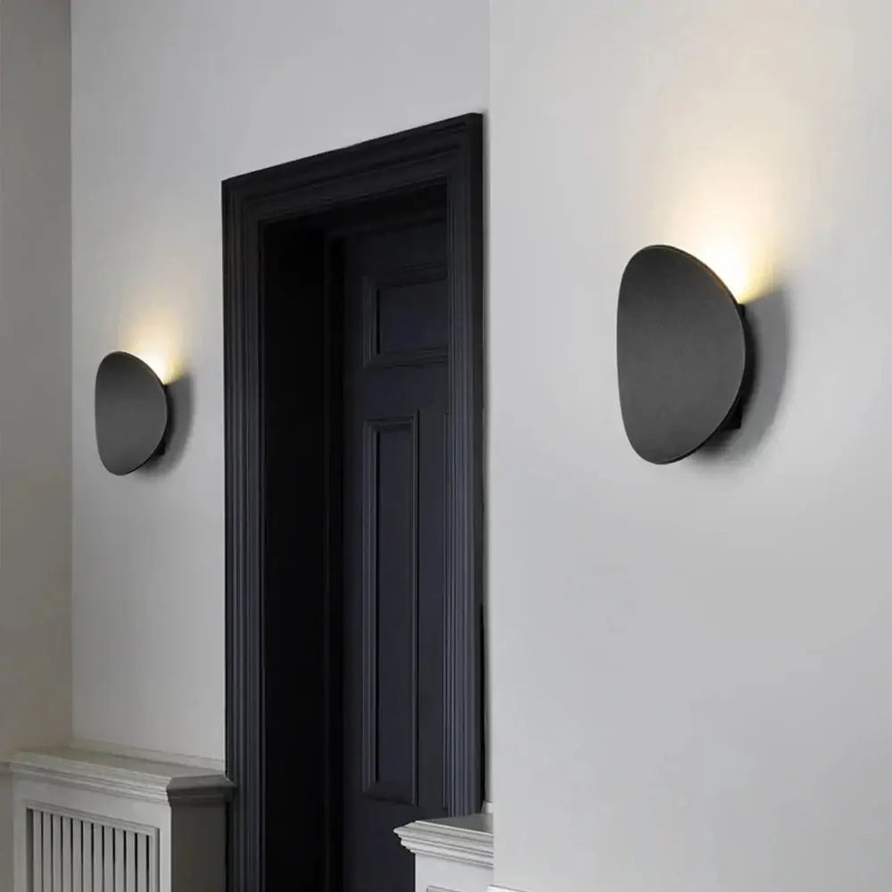 Modern matte black oval led wall light with warm soft lighting for living room decorbites led wall sconce