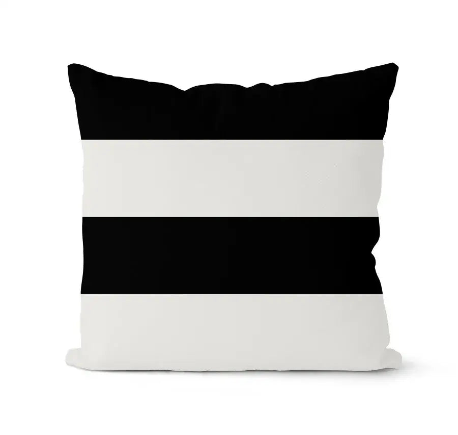 Modern geometric black and white pillowcase set featuring a black and white striped throw pillow with bold horizontal bands